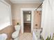 Full bathroom with toilet, shower/tub, and window at 714 Winfree Ave, Lakeland, FL 33801