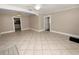 Bright living room with tile floors and views into kitchen and hallway at 714 Winfree Ave, Lakeland, FL 33801