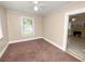 Bright bedroom with carpeted floor, ceiling fan and window at 714 Winfree Ave, Lakeland, FL 33801