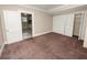 Bedroom with access to kitchen and double closets at 714 Winfree Ave, Lakeland, FL 33801