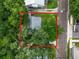Overhead view of house nestled among lush trees at 714 Winfree Ave, Lakeland, FL 33801