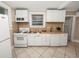 Efficient kitchen with white cabinets, gas range and dishwasher at 714 Winfree Ave, Lakeland, FL 33801