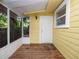 Inviting screened porch with wood flooring and exterior access at 714 Winfree Ave, Lakeland, FL 33801