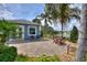 Relaxing paver patio with seating area and stunning view of a pond at 544 Narrow Pond Rd, Polk City, FL 33868
