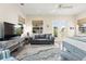 Main bedroom with sitting area and access to private backyard at 544 Narrow Pond Rd, Polk City, FL 33868