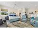 Comfortable main bedroom with sitting area, ensuite bathroom, and large windows at 544 Narrow Pond Rd, Polk City, FL 33868