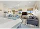 Bright and airy main bedroom with sitting area and large windows at 544 Narrow Pond Rd, Polk City, FL 33868