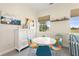Cozy sitting area in the main bedroom with a large TV and comfortable seating at 544 Narrow Pond Rd, Polk City, FL 33868