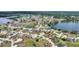 Aerial view of home situated in a lakefront community at 544 Narrow Pond Rd, Polk City, FL 33868
