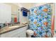 Bathroom with granite countertop and shower/tub combo at 544 Narrow Pond Rd, Polk City, FL 33868