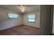 Simple bedroom with carpet flooring and ceiling fan at 2602 Ewell Rd, Lakeland, FL 33811