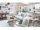 Cozy living room featuring a light grey sofa and wooden accents at 5499 Maddie Dr, Haines City, FL 33844