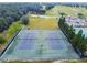 Two well-maintained tennis courts with chain link fencing at 1045 View Pointe Way, Lakeland, FL 33813