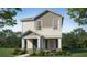 Two-story house with gray and beige siding, green door, and stone accents at 265 Crossings Ave, St Cloud, FL 34771
