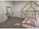 Bright bedroom with a bed and full-length mirror at 265 Crossings Ave, St Cloud, FL 34771