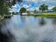 Serene view of a canal with lush vegetation and houses at 180 Lakeview Dr, Haines City, FL 33844