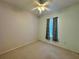 Bedroom with ceiling fan and window coverings at 180 Lakeview Dr, Haines City, FL 33844