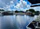 View of calm canal with neighboring houses and docks at 180 Lakeview Dr, Haines City, FL 33844