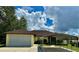 Single-story home with attached garage and carport at 180 Lakeview Dr, Haines City, FL 33844