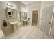 Bathroom with double sinks, a large mirror, and plenty of storage at 180 Lakeview Dr, Haines City, FL 33844