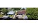 Aerial view of waterfront home with private dock and lush landscaping at 180 Lakeview Dr, Haines City, FL 33844
