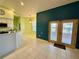 Kitchen with granite countertops, and access to a deck overlooking the water at 180 Lakeview Dr, Haines City, FL 33844