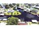 Aerial view of waterfront property with private pool and canal access at 180 Lakeview Dr, Haines City, FL 33844