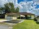 Home exterior showcasing a carport and spacious yard at 180 Lakeview Dr, Haines City, FL 33844