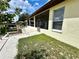 Back exterior view showing screened porch and landscaping at 180 Lakeview Dr, Haines City, FL 33844
