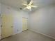 Bedroom with ceiling fan and double door closet at 180 Lakeview Dr, Haines City, FL 33844