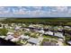 Aerial view of waterfront homes and community with lush greenery at 180 Lakeview Dr, Haines City, FL 33844