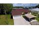Aerial view of a house with a carport and a large yard at 180 Lakeview Dr, Haines City, FL 33844
