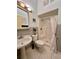 Bathroom with shower, sink, and toilet at 180 Lakeview Dr, Haines City, FL 33844