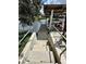 Concrete steps leading down to a wooden dock at 180 Lakeview Dr, Haines City, FL 33844
