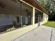 Enclosed porch with ceiling fan, refrigerator, and laundry area at 180 Lakeview Dr, Haines City, FL 33844