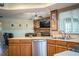 Kitchen with island, stainless steel appliances, and view of living room at 310 Willow Oak Ct, Fort Meade, FL 33841