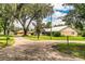 Ranch style home with metal roof and mature landscaping at 310 Willow Oak Ct, Fort Meade, FL 33841