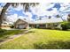 One-story home with metal roof and landscaped yard at 310 Willow Oak Ct, Fort Meade, FL 33841
