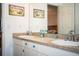 Double vanity bathroom with coastal-themed decor at 310 Willow Oak Ct, Fort Meade, FL 33841