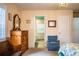 Bright main bedroom with window seat, wood furniture, and ensuite bathroom at 310 Willow Oak Ct, Fort Meade, FL 33841