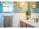 Bathroom with double vanity and wood cabinets at 310 Willow Oak Ct, Fort Meade, FL 33841