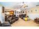 Spacious living room with leather recliners and a ceiling fan at 310 Willow Oak Ct, Fort Meade, FL 33841