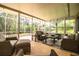 Enjoy this screened porch with comfortable seating and backyard view at 310 Willow Oak Ct, Fort Meade, FL 33841