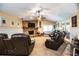Bright living room with fireplace, comfortable seating, and access to backyard at 310 Willow Oak Ct, Fort Meade, FL 33841