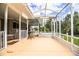 Spacious screened porch overlooking a pool and backyard at 310 Willow Oak Ct, Fort Meade, FL 33841