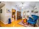 Sunroom features hardwood floors, French doors, and a ceiling fan at 310 Willow Oak Ct, Fort Meade, FL 33841