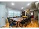 Farmhouse-style dining room with wooden table and black chairs at 310 Willow Oak Ct, Fort Meade, FL 33841