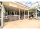 Relaxing screened porch with patio furniture and pool view at 310 Willow Oak Ct, Fort Meade, FL 33841