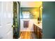 Bathroom with wood cabinets, granite countertop, and a shower with a rainforest curtain at 310 Willow Oak Ct, Fort Meade, FL 33841