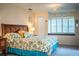 Spacious Primary bedroom with window seat and floral bedding at 310 Willow Oak Ct, Fort Meade, FL 33841